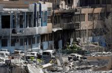 The National Hospital, last stronghold of the Islamic state militants, is pictured from the positions of the Syrian Democratic Forces at the frontline in Raqqa, Syria, October 8, 2017. PHOTO BY REUTERS/Erik De Castro