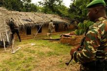 OPIR agents responsible for Mont Peko, prepare to destroy a house during an eviction operation of illegal farmers from Burkina Fasso inside the Mont Peko National Park in Duekoue department, western Ivory Coast, August 2, 2016. PHOTO BY REUTERS/Luc Gnago