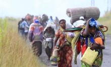 Displaced families flee from renewed fighting between the Congolese Revolutionary Army (CRA) and Congolese army in Sake, 27km (16 miles) north of Goma, November 23, 2012. PHOTO BY REUTERS/James Akena