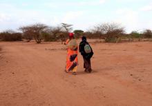 Internally displaced women from drought hit area, carry their jerry cans filled with water as they walk toward their shelter at a makeshift settlement in Dollow, Somalia, April 5, 2017. PHOTO BY REUTERS/Zohra Bensemra