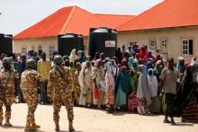 Security officers man the Bakkasi camp for internally displaced people, after security was called to control some refugees, who rallied against camp authorities for what they say is poor distribution of food rations, in Borno, Nigeria, August 29, 2016. PHOTO BY REUTERS/Afolabi Sotunde