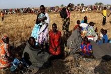 Women and children wait to be registered prior to a food distribution carried out by the United Nations World Food Programme (WFP) in Thonyor, Leer state, South Sudan, February 25, 2017. PHOTO BY REUTERS/Siegfried Modola