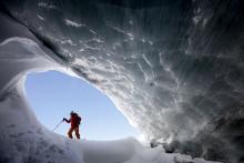  Glaciologist Andrea Fischer from the Austrian Institute for Interdisciplinary Mountain Research, walks at the entrance of an ice cave of Jamtalferner glacier near Galtuer, Austria, February 18, 2019. PHOTO BY REUTERS/Lisi Niesner