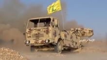 A still image taken on July 21, 2017 from an undated footage by Hezbollah Military handout shows a weapon being fired from the back of a truck with a Hezbollah flag on it at an unidentified location at the Syrian-Lebanese frontier. PHOTO BY REUTERS/Hezbollah Military