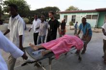 Madina hospital staff help to wheel an injured Medecins Sans Frontieres (MSF) personnel on a stretcher south of capital Mogadishu, December 29, 2011. PHOTO BY REUTERS/Feisal Omar