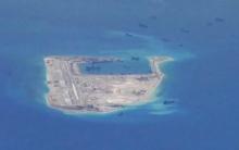 Chinese dredging vessels are purportedly seen in the waters around Fiery Cross Reef in the disputed Spratly Islands in the South China Sea in this still image from video taken by a P-8A Poseidon surveillance aircraft provided, May 21, 2015. PHOTO BY REUTERS/U.S. Navy