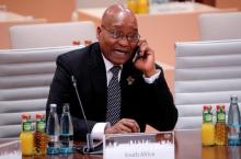 South African President Jacob Zuma talks on the phone before a working session at the G20 leaders summit in Hamburg, Germany, July 8, 2017. PHOTO BY REUTERS/Wolfgang Rattay