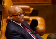 President Jacob Zuma looks on as members of Julius Malema's Economic Freedom Fighters (EFF) party raise objections before being evicted from Parliament during his question and answer session in Cape Town, South Africa, May 17, 2016. PHOTO BY REUTERS/Mike Hutchings