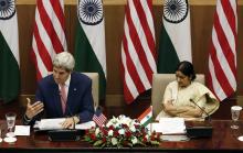 U.S. Secretary of State John Kerry addresses the media as India's External Affairs Minister Sushma Swaraj (R) looks on during their joint news conference New Delhi