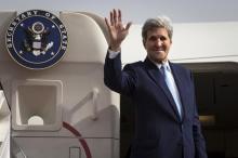 U.S. Secretary of State John Kerry waves at the top of the stairs as he boards his plane to head back to the United States in Riyadh, Saudi Arabia, October 25, 2015. PHOTO BY REUTERS/Carlo Allegri