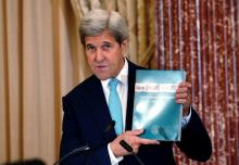 U.S. Secretary of State John Kerry holds up at copy of the 2016 Trafficking in Persons (TIP) report during the TIP Heroes Ceremony at the State Department in Washington, June 30, 2016. PHOTO BY REUTERS/Kevin Lamarque