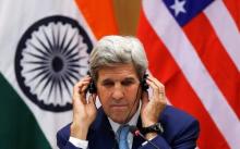 U.S. Secretary of State John Kerry adjusts his ear phones during a joint news conference with India's External Affairs Minister Sushma Swaraj (not pictured) in New Delhi, India, August 30, 2016. PHOTO BY REUTERS/Adnan Abidi