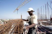 Kamara, 29, a migrant from Guinea, works at the construction site of a building in Algiers, Algeria, June 29, 2017. PHOTO BY REUTERS/Ramzi Boudina