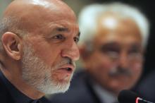 Afghanistan's President Hamid Karzai addresses media representatives during a press interaction in New Delhi