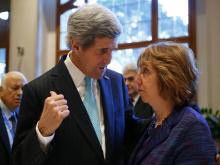 U.S. Secretary of State John Kerry (L) talks to EU foreign policy chief Catherine Ashton prior to peace talks in Montreux