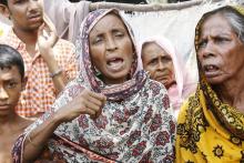Khaleda Banu speaks about her son, missing since November, in Teknaf, Bangladesh, May 30, 2015. PHOTO BY REUTERS/Rafiqur Rahman