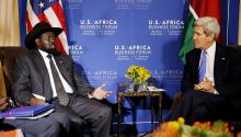 South Sudan's President Salva Kiir (L) talks with U.S. Secretary of State John Kerry as they hold a bilateral meeting at the U.S.-Africa Business Forum in Washington