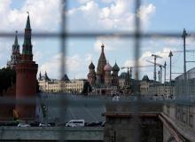 A view through a construction fence shows the Kremlin towers and St. Basil's Cathedral on a hot summer day in central Moscow, Russia, July 1, 2016. PHOTO BY REUTERS/Maxim Zmeyev