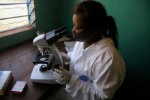 A laboratory worker uses a microscope at the health centre in the commune of Wangata during a vaccination campaign against the outbreak of Ebola, in Mbandaka, Democratic Republic of Congo, May 23, 2018. PHOTO BY REUTERS/Kenny Katombe