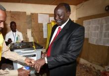 SPLM Democratic Change Party Leader Lam Akol has his finger inked after casting his vote at the polling centre in Khartoum, January 9, 2011. PHOTO BY REUTERS/Mohamed Nureldin Abdallah