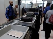 Baggage and a laptop are scanned using the Transport Security Administration's new Automated Screening Lane technology at Terminal 4 of JFK airport in New York City, U.S., May 17, 2017. PHOTO BY REUTERS/Joe Penney