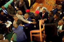 Ugandan lawmakers involve in a fight in the parliament ahead of proposed age limit amendment bill debate a move to change the constitution to extend the president's rule, in Kampala, Uganda, September 26, 2017. PHOTO BY REUTERS/James Akena