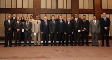 Libya's new Prime Minister Ahmed Maiteeq (6th L), President of the General National Congress Nouri Abusshmin (7th L) and other members of the new Libyan government pose for a group photo in Tripoli