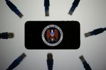 An illustration picture shows the logo of the U.S. National Security Agency on the display of an iPhone in Berlin, June 7, 2013. PHOTO BY REUTERS/Pawel Kopczynski