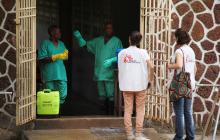 Medecins Sans Frontieres (MSF) workers talk to a worker at an isolation facility, prepared to receive suspected Ebola cases, at the Mbandaka General Hospital, in Mbandaka, Democratic Republic of Congo, May 20, 2018. PHOTO BY REUTERS/Kenny Katombe