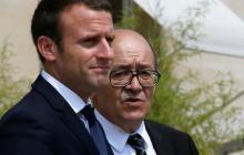 French President Emmanuel Macron walks next to Foreign Minister Jean-Yves Le Drian after a meeting about Qatar crisis at the Elysee Place in Paris France, June 21, 2017. PHOTO BY REUTERS/Gonzalo Fuentes