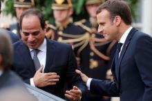 French President Emmanuel Macron greets Egyptian President Abdel Fattah al-Sisi as he leaves the Elysee palace, in Paris, France, October 24, 2017. PHOTO BY REUTERS/Philippe Wojazer