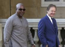 John Dramani Mahama the President of Ghana (L) is met by Britain's Foreign Office minister Hugo Swire as he arrives at a summit on corruption at Lancaster House in central London, Britain, May 12, 2016. PHOTO BY REUTERS/Paul Hackett