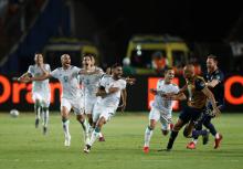 Algeria's Riyad Mahrez celebrates scoring their second goal with teammates. PHOTO BY REUTERS/Amr Abdallah Dalsh