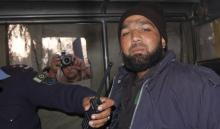 Malik Mumtaz Hussain Qadri, a bodyguard who killed Punjab governor Salman Taseer, is photographed after being detained at the site of Taseer's shooting in Islamabad, January 4, 2011. PHOTO BY REUTERS/Saaf-ur-Rahman