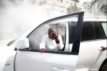 An opposition politician of the National Super Alliance coalition reacts after a gas canister fired by police hits his car during a protest along a street in Nairobi. PHOTO BY REUTERS/Baz Ratner