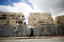 An ultra-Orthodox Jewish man walks on a road in the Israeli settlement of Beitar Illit in the occupied West Bank, February 15, 2017. PHOTO BY REUTERS/Amir Cohen