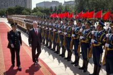 China's Defense Minister Wei Fenghe, left, and U.S. Defense Secretary Jim Mattis review an honor guard during a welcome ceremony at the Bayi Building in Beijing, Wednesday, June 27, 2018. PHOTO BY REUTERS/Mark Schiefelbein