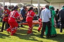 Medics attend to people injured in an explosion during a rally by Zimbabwean President Emmerson Mnangagwa in Bulawayo, Zimbabwe, June 23, 2018. PHOTO BY REUTERS/Tafadzwa Ufumeli