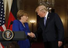 U.S. President Donald Trump greets Germany's Chancellor Angela Merkel during a joint news conference in the East Room of the White House in Washington, U.S., April 27, 2018. PHOTO BY REUTERS/Kevin Lamarque