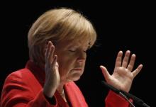 German Chancellor Angela Merkel gestures during a election campaign in the western town of Soest