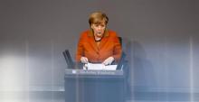 German Chancellor Angela Merkel makes a point during her speech at the German lower house of parliament Bundestag in Berlin