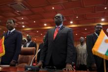 Burkina Faso President Michel Kafando (C) attends a ceremony marking the return of the transitional government in Ouagadougou, Burkina Faso, September 23, 2015. PHOTO BY REUTERS/Joe Penney