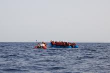 A blue inflatable boat carrying 65 people, about 34 miles from the Libyan coast according to Sea-eye, is seen in this picture obtained from social media on July 5, 2019. PHOTO BY REUTERS/Courtesy of Sea-eye/Social Media 