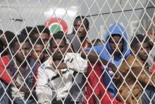 Migrants wait to disembark from the Italian navy ship Borsini in the Sicilian harbour of Palermo, May 5, 2015. PHOTO BY REUTERS/Guglielmo Mangiapane