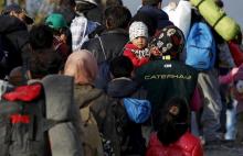 Migrants wait to enter a transit camp after entering the country by crossing the border with Greece in Gevgelija, Macedonia, November 10, 2015. PHOTO BY REUTERS/Ognen Teofilovski