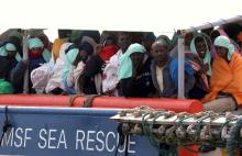 Migrants wait to disembark from the Medecins Sans Frontieres (MSF) vessel at Pozzallo's harbour in Sicily, Italy, 25 April, 2016. PHOTO BY REUTERS/Antonio Parrinello