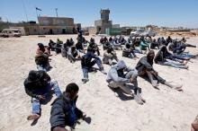 Migrants, who attempted to flee the Libyan coast to head for Europe, are seen after being detained at the coast guard center in the coastal city of Tripoli, Libya, May 16, 2016. PHOTO BY REUTERS/Ismail Zitouny