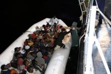 Migrants in a dinghy are rescued by Libyan coast guards in the Mediterranean Sea off the coast of Libya, March 15, 2018. PHOTO BY REUTERS/Hani Amara