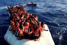 An overcrowded dinghy with migrants from different African countries is followed by members of the German NGO Jugend Rettet as they approach the Iuventa vessel during a rescue operation, off the Libyan coast in the Mediterranean Sea, September 21, 2016. PHOTO BY REUTERS/Zohra Bensemra