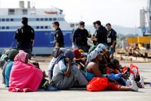 Migrants rests after disembarking from Dignity ship in the Sicilian harbour of Augusta, Italy, October 19, 2016. PHOTO BY REUTERS/Antonio Parrinello